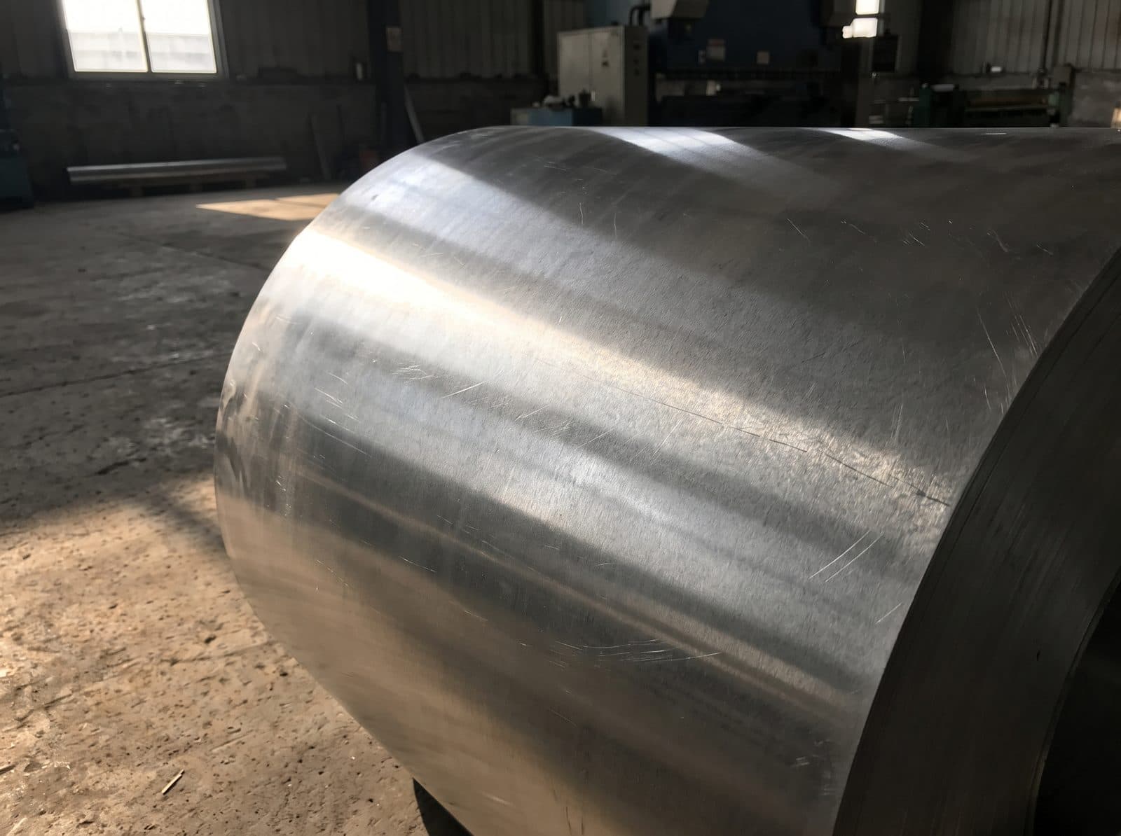 Unbranded metal coil in a workshop.